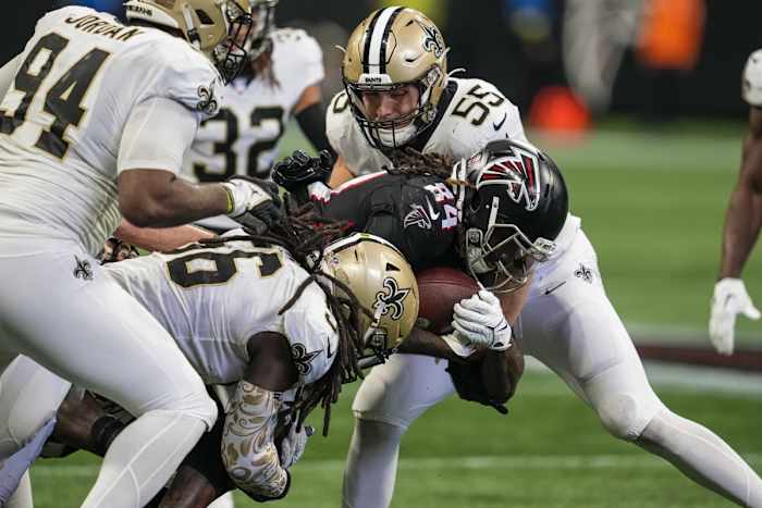 New Orleans Saints linebackers Kaden Elliss (55) and Demario Davis (56) tackle Atlanta Falcons running back Cordarrelle Patterson (84). Mandatory Credit: Dale Zanine-USA TODAY